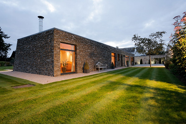 Rear facade of architect designed walled garden villa